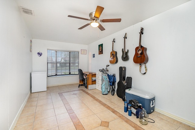 misc room with ceiling fan and light tile patterned flooring