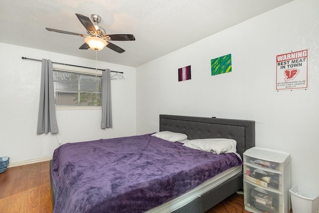 bedroom featuring ceiling fan and wood-type flooring