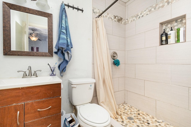 bathroom with a shower with curtain, vanity, and toilet