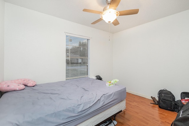 bedroom featuring hardwood / wood-style flooring and ceiling fan