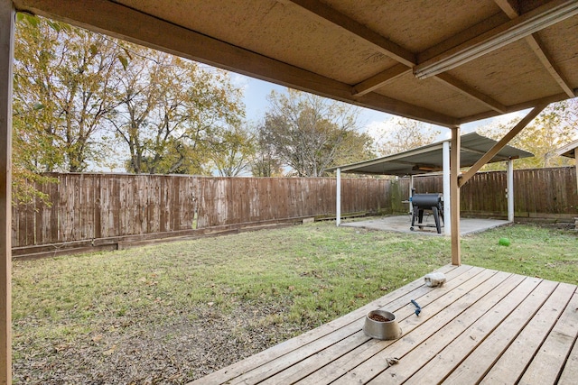 view of yard featuring a deck and a patio area