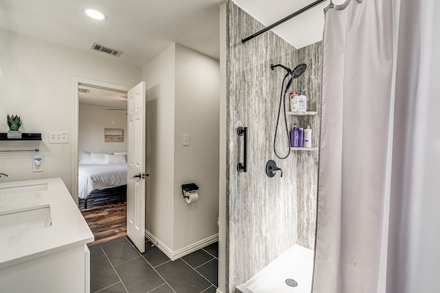 bathroom with tile patterned flooring, vanity, and a shower with shower curtain