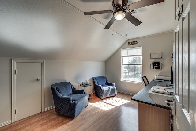 home office featuring light hardwood / wood-style flooring, ceiling fan, and vaulted ceiling