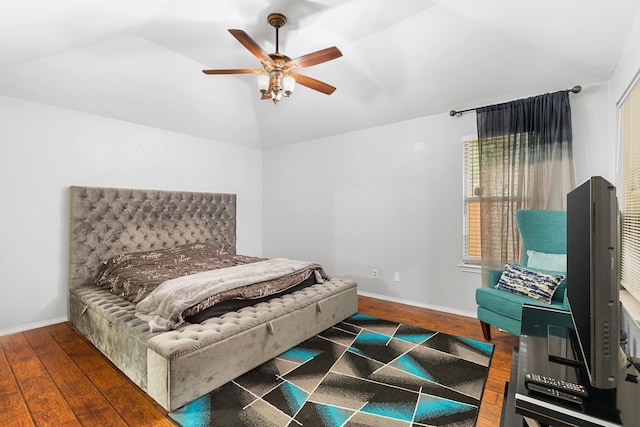 bedroom featuring vaulted ceiling, ceiling fan, and dark hardwood / wood-style floors