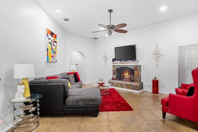 tiled living room featuring ceiling fan