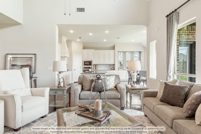 living room with a towering ceiling