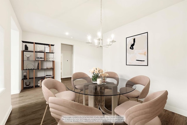 dining area with dark wood-style floors, baseboards, and a chandelier