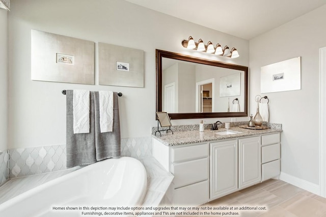 bathroom with vanity, tiled bath, and tile patterned floors