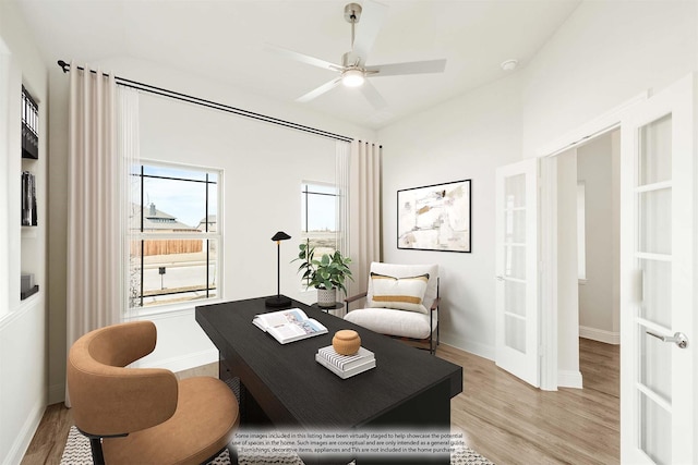 office featuring light wood-type flooring, a ceiling fan, and french doors