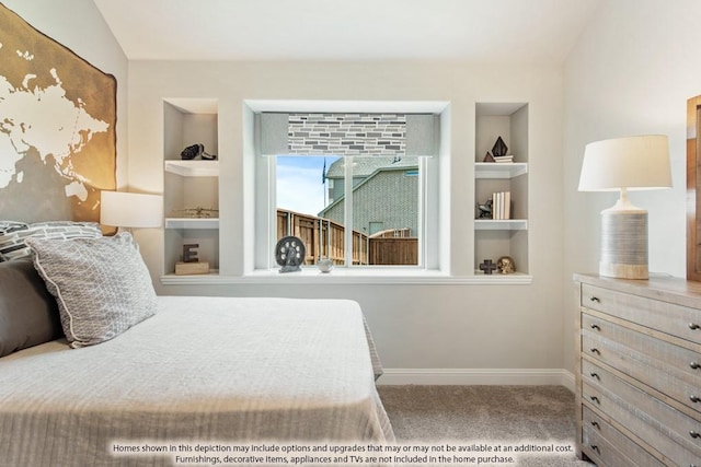 carpeted bedroom with vaulted ceiling