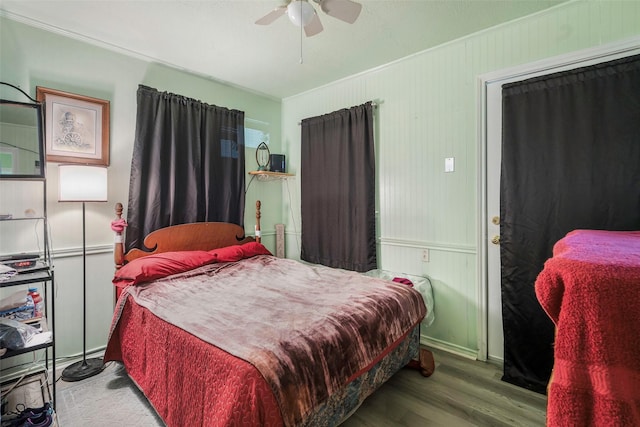 bedroom featuring ceiling fan, crown molding, and hardwood / wood-style floors