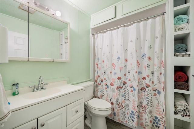 bathroom with walk in shower, vanity, crown molding, hardwood / wood-style flooring, and toilet