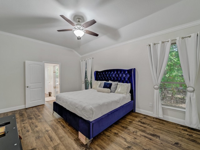 bedroom featuring dark wood-type flooring, connected bathroom, crown molding, vaulted ceiling, and ceiling fan