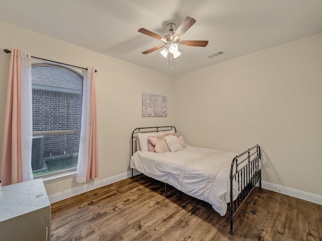 bedroom featuring hardwood / wood-style floors and ceiling fan