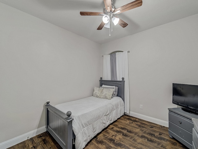 bedroom featuring dark hardwood / wood-style floors and ceiling fan