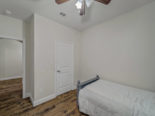 bedroom featuring dark hardwood / wood-style flooring and ceiling fan