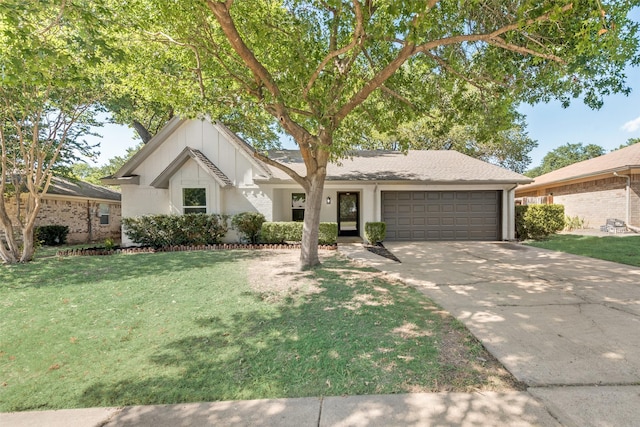 view of front of house featuring a garage and a front lawn