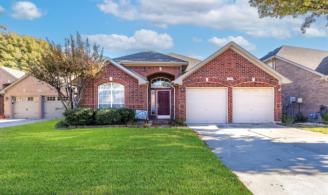 view of front property with a garage and a front lawn