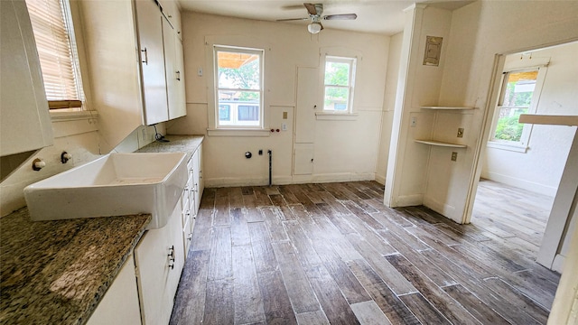 interior space with ceiling fan, plenty of natural light, sink, and dark hardwood / wood-style flooring