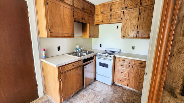 kitchen featuring electric stove and sink