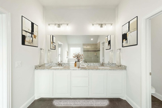 bathroom with tile patterned flooring, toilet, a tile shower, and vanity