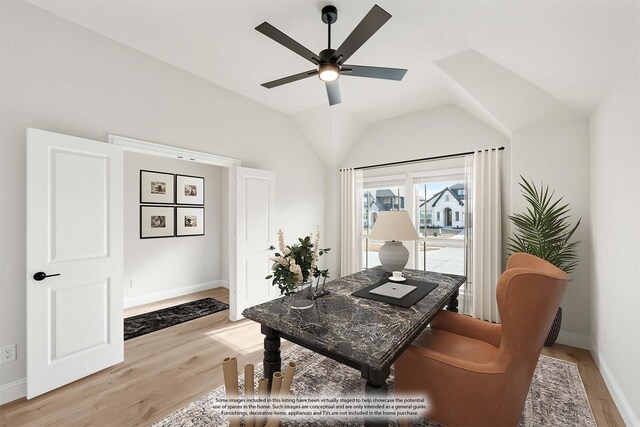 living room featuring ceiling fan and light hardwood / wood-style flooring