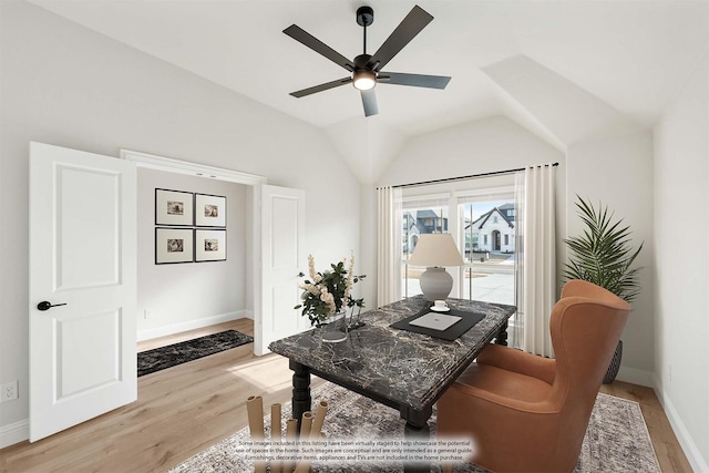 office space with light wood-type flooring, lofted ceiling, and ceiling fan