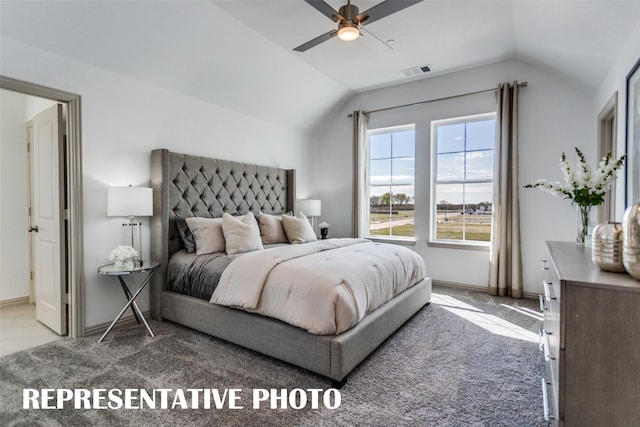 bedroom featuring carpet floors, vaulted ceiling, and ceiling fan