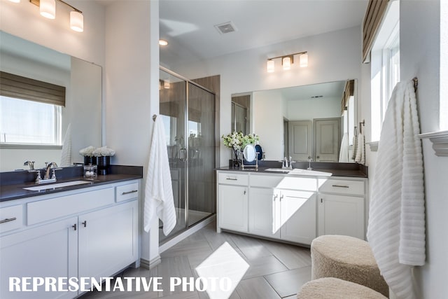 bathroom with vanity and an enclosed shower