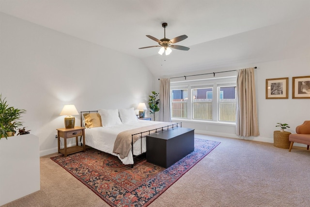 bedroom with carpet floors, vaulted ceiling, and ceiling fan