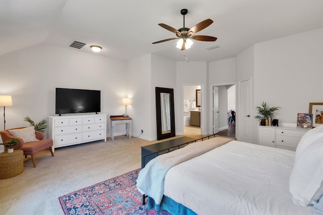 carpeted bedroom featuring ensuite bathroom, ceiling fan, and vaulted ceiling