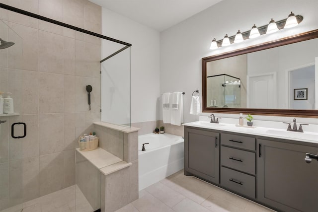 bathroom featuring vanity, tile patterned flooring, and plus walk in shower