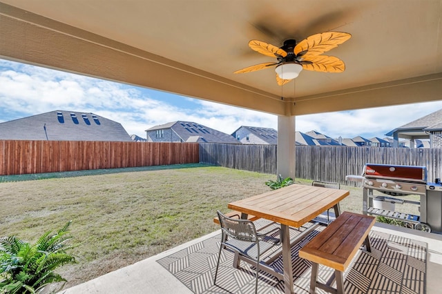 view of patio / terrace featuring a grill and ceiling fan