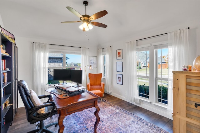 office area with plenty of natural light, ceiling fan, and dark hardwood / wood-style flooring