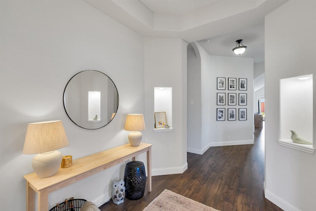 hall with dark hardwood / wood-style floors