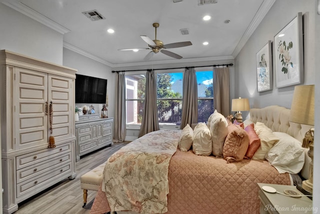 bedroom featuring ornamental molding, ceiling fan, and light hardwood / wood-style flooring