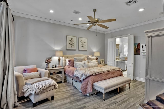 bedroom with ornamental molding, light hardwood / wood-style floors, and ensuite bath