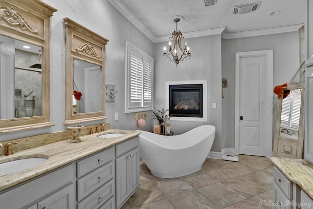 bathroom with tile patterned flooring, an inviting chandelier, vanity, ornamental molding, and plus walk in shower