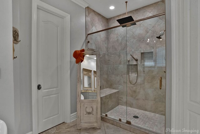 bathroom featuring walk in shower and tile patterned flooring