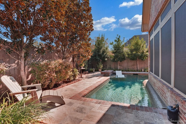 view of swimming pool featuring a patio