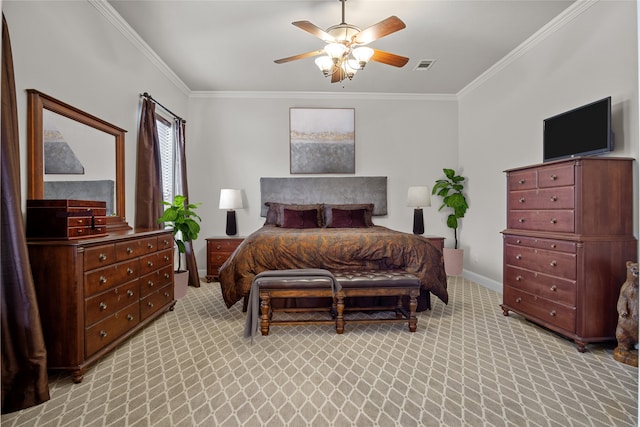 carpeted bedroom with ceiling fan and ornamental molding