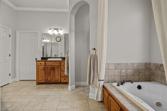 bathroom featuring a washtub, tile patterned flooring, vanity, and ornamental molding