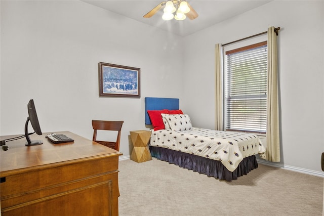 bedroom with ceiling fan and light colored carpet