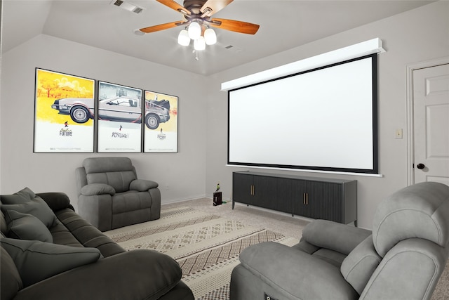 carpeted cinema featuring ceiling fan and lofted ceiling