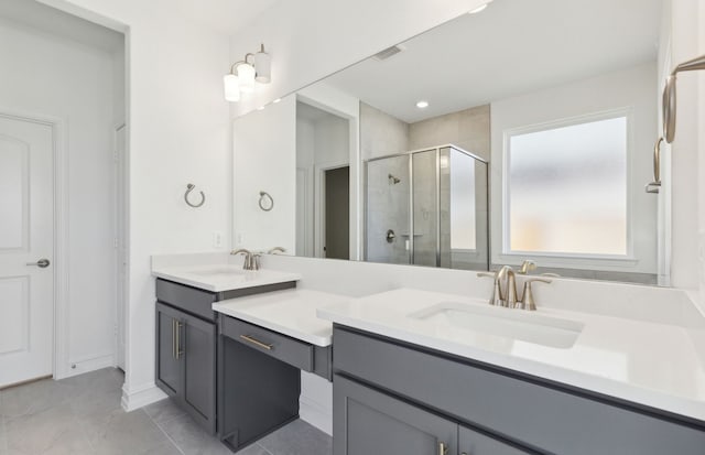 bathroom with walk in shower and vanity