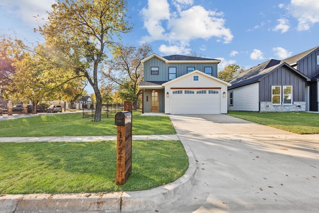 view of front of house with a garage and a front yard