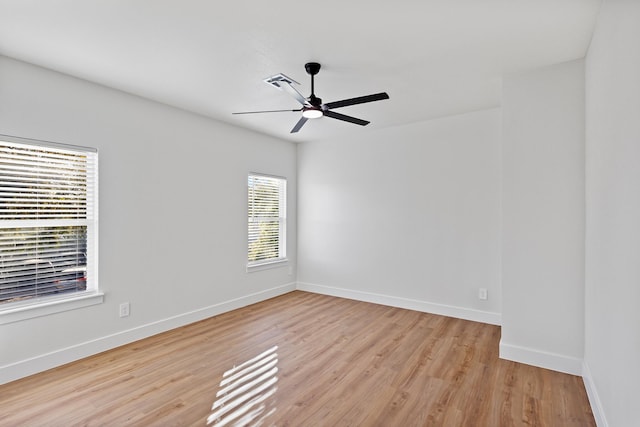 unfurnished room with ceiling fan and light wood-type flooring