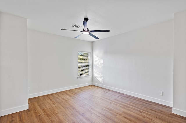 unfurnished room with ceiling fan and light wood-type flooring