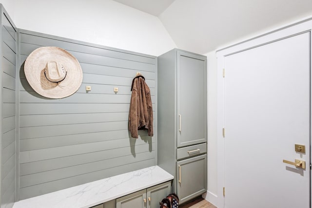 mudroom featuring lofted ceiling