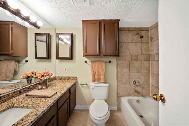 full bathroom featuring tile patterned flooring, a textured ceiling, toilet, vanity, and tiled shower / bath